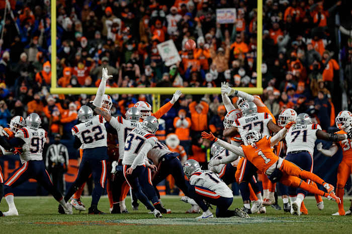 New England Patriots place kicker Chad Ryland (37) scores the game winning field goal on a hold from punter Bryce Baringer (17) as Denver Broncos cornerback Tremon Smith (1) defends in the fourth quarter at Empower Field at Mile High.
